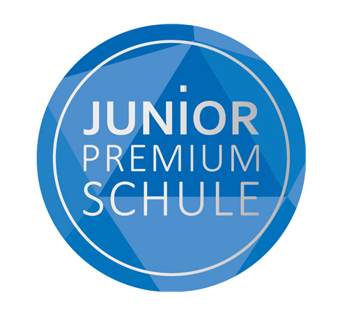 Logo von JUNIOR Premium Schule, Aufschrift auf blauem Grund: JUNIOR Premium Schule